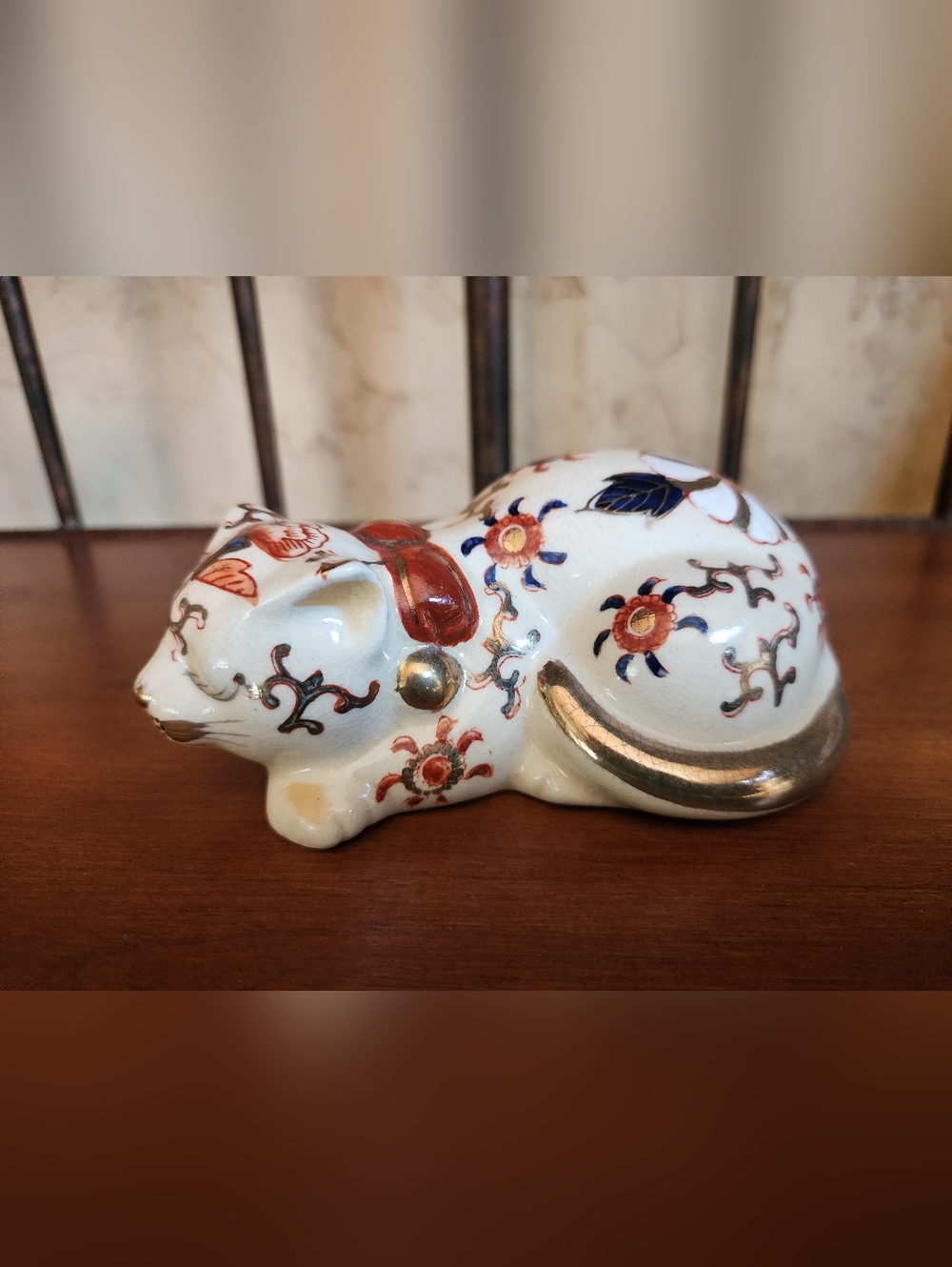 Decorative White Ceramic Sleeping Cat Figurine with Floral Accents